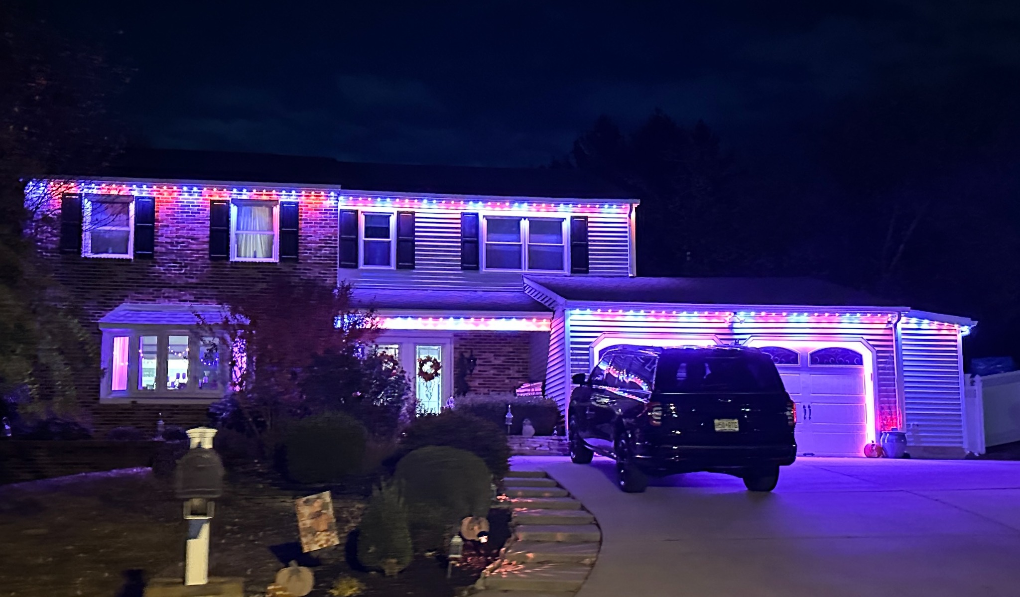 App controlled permanent Christmas lights showing dense uniform lighting across a South Jersey home